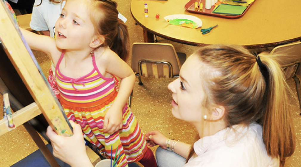 Teacher and child in a classroom
